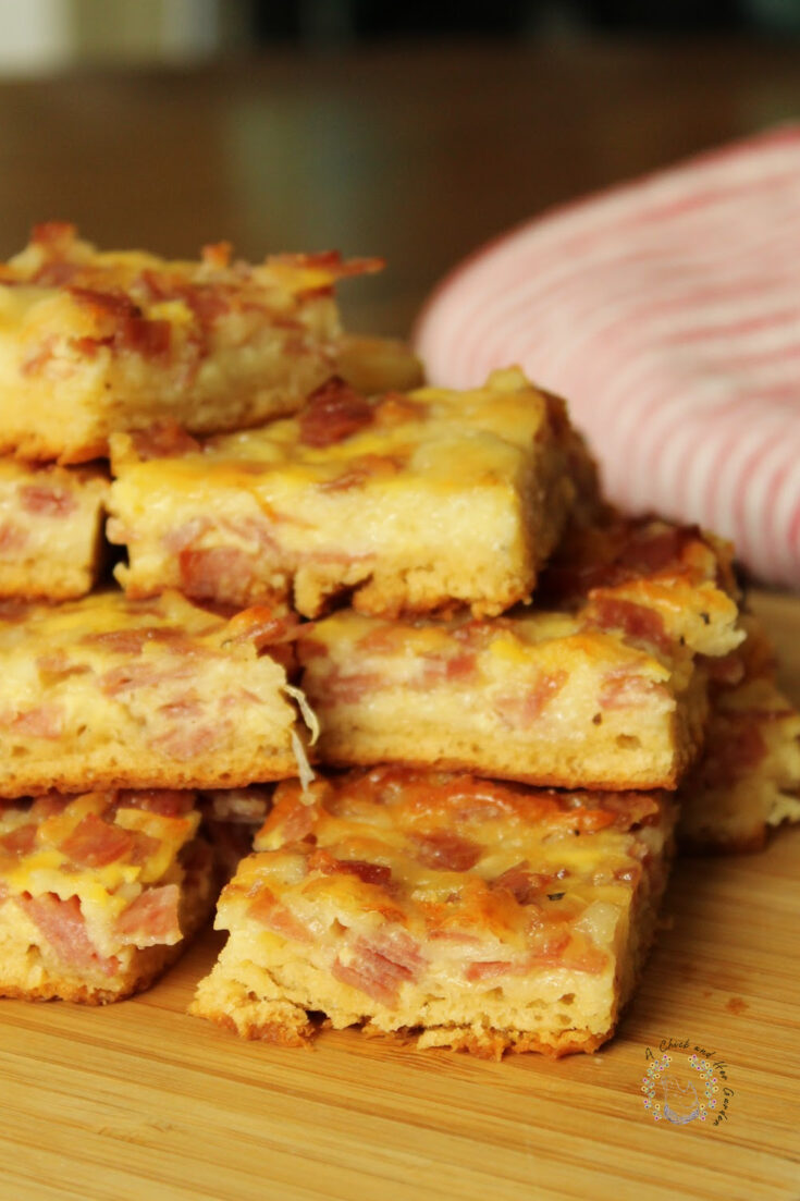 salami squares stacked on a bamboo tray